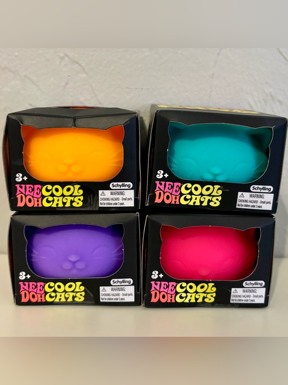 NeeDoh Cool Cats Squeeze Toy - Orange, Teal, Purple, Pink